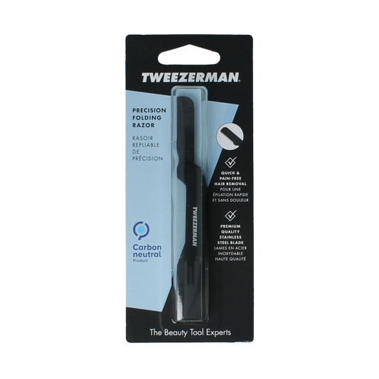 Tweezerman eyebrow shaper tool with a precision blade for grooming eyebrows, shown with a sleek, compact design.