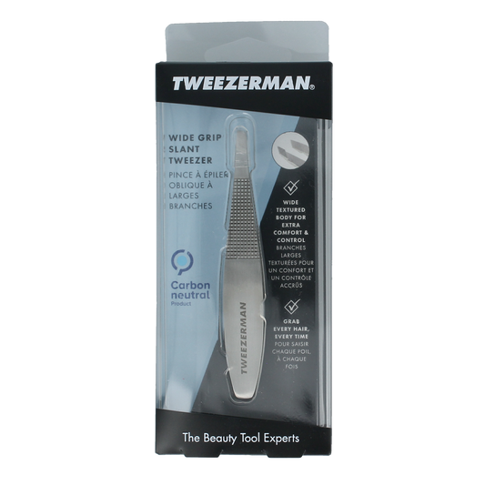 Tweezerman Slant tweezer with no-slip grip in stainless steel, shown with open tips for precise eyebrow plucking.