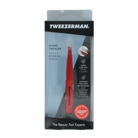 Tweezerman Slant tweezer in signature red with stainless steel construction, ideal for precise eyebrow grooming.