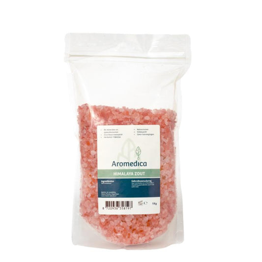 Aromedica Himalaya zout grof 1 kg, natural Himalayan rock salt in a clear container, suitable for cooking and seasoning.
