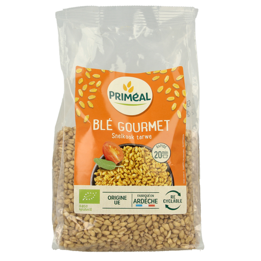 Primeal Tarwe gastronomisch bio ontbijtgranen in een 500 gram verpakking, close-up van de graanvlokken in de afbeelding.