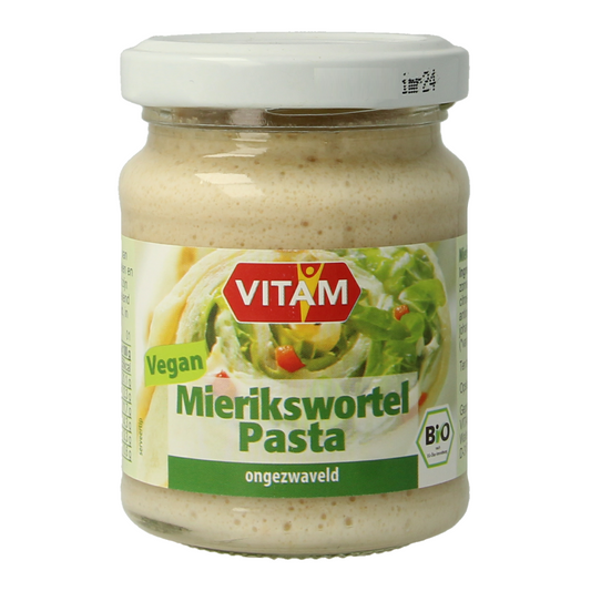 Vitam Mierikswortel bio pasta spread on bread, showing a jar with mustard-like yellow color and label details.