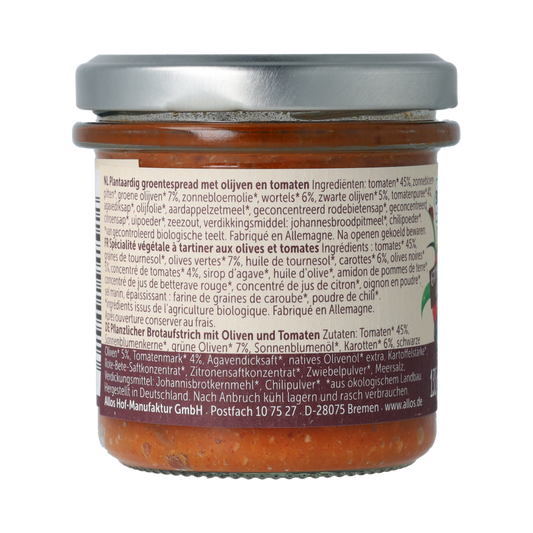 Allos Farm organic tomato and olive spread on bread, packaged as broodb en beleg, 135 grams, with fresh vegetables visible.