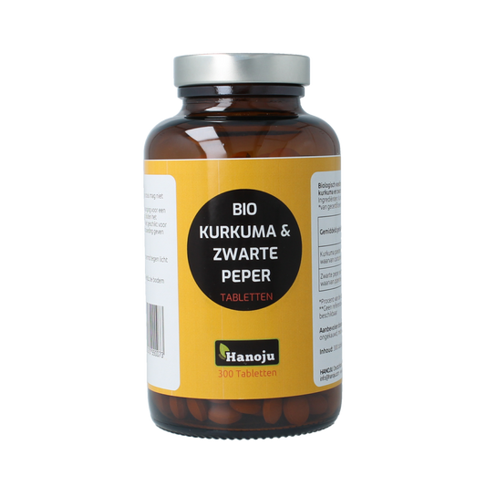 Hanoju Kurkumapoeder + piperine bio dietary supplement tablets, 500mg, natural herbal preparation in a container.