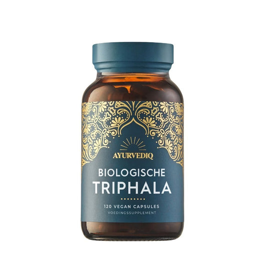 Ayurvediq Biologische Triphala capsules, herbal supplement in a white bottle with a label, natural herbal product for health support.