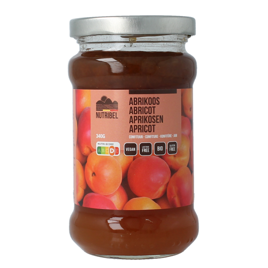 Nutribel bio apricot jam spread on bread, 340g jar, natural fruit preserves in a glass jar with a golden lid.