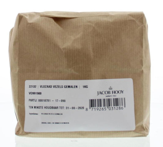 Ground flaxseed fibers in a clear jar from Jacob Hooy, part of herbal, salt, and meal mixes, weighing 1 kilogram.