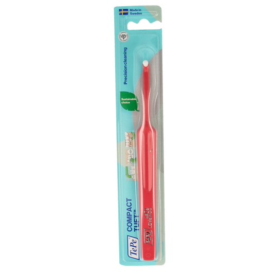 TePe compact tuft toothbrush with small head and colorful bristles, designed for precise dental cleaning and oral hygiene.