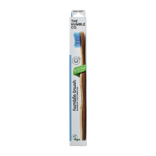 Blue bamboo toothbrush by The Humble Co for adults with soft bristles, shown with handle and bristle head visible.