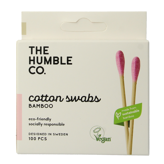 Pair of purple bamboo cotton swabs from The Humble Co for ear care, shown in close-up with packaging in the background.