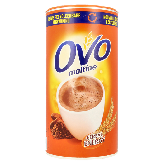 Ovomaltine instant drink powder in 650g tin, Ovomaltine brand, shown in a container with a scoop for making malt beverages.
