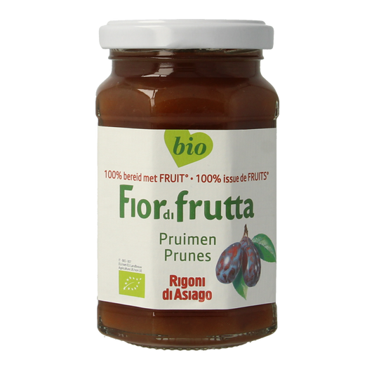 Fiordifrutta organic prune jam spread on bread in a jar, showcasing a rich, dark fruit preserve for breakfast or snacks.
