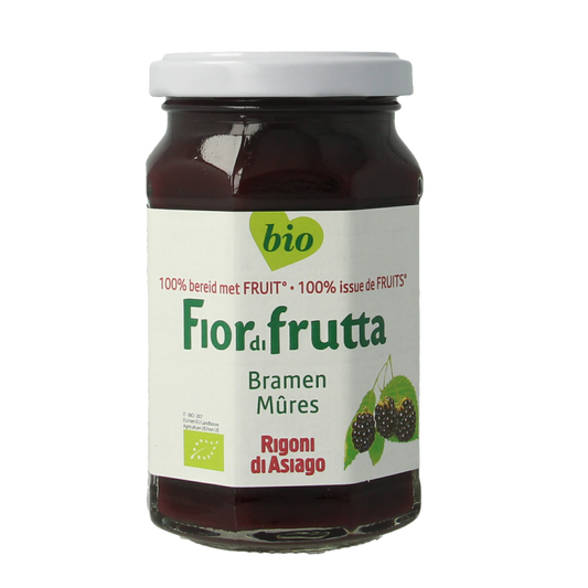 Fiordifrutta Bramenjam bio spread on bread, showing jar with dark purple berry jam and fresh bread slices.