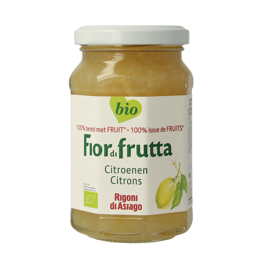 Fiordifrutta Citroenjam bio spread on bread, showing bright yellow citrus jam in a jar with a spoon.