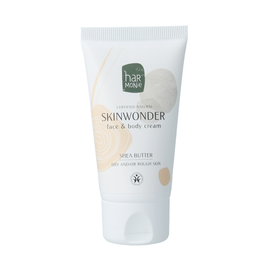 Harmonie Skinwonder Face & Body Cream BIO, 50ml, in a white jar with a silver lid, showing the product label.
