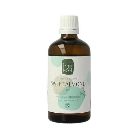 Harmonie Zoete Amandelolie in a 100ml bottle, natural body care product with a clear label and golden liquid inside.