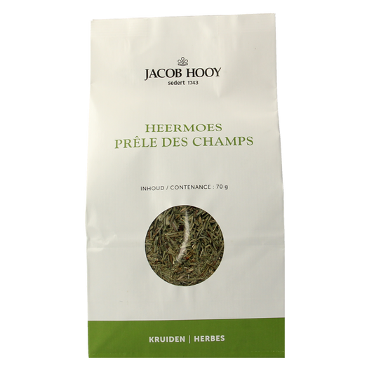 Jar of Jacob Hooy Heermoes herbal spice mix in a clear glass container, labeled with product details, on a white background.