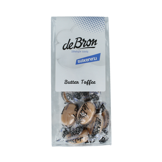 De Bron Buttertoffee suikervrij snoepgoed in 65g package showing golden caramel candies with a smooth texture.