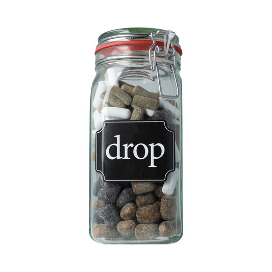 Kindly's Weckpot snoep drop in a clear glass jar, filled with colorful candy drops, on a white background.