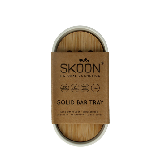 Skoon solid bar holder in white for bathroom and toilet, made of durable material, designed to hold soap or bars securely.