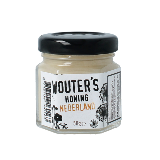 De Traay Wouters Nederlandse voorjaarshoning in 50g jar, showcasing golden honey with a smooth texture and natural floral notes.