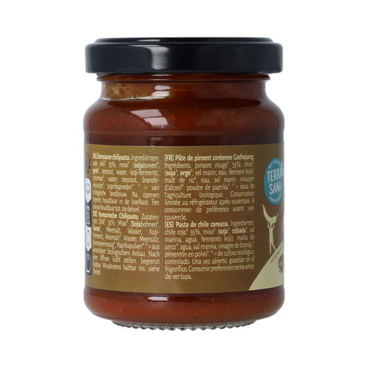 TerraSana Gochujang pasta bio in 135g package, showing the vibrant red chili paste in a glass jar.