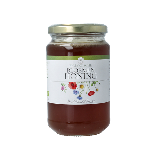 Organic Michel Merlet Bloemenhoning honey jar, 450 grams, with a golden, textured honey surface and natural floral label design.