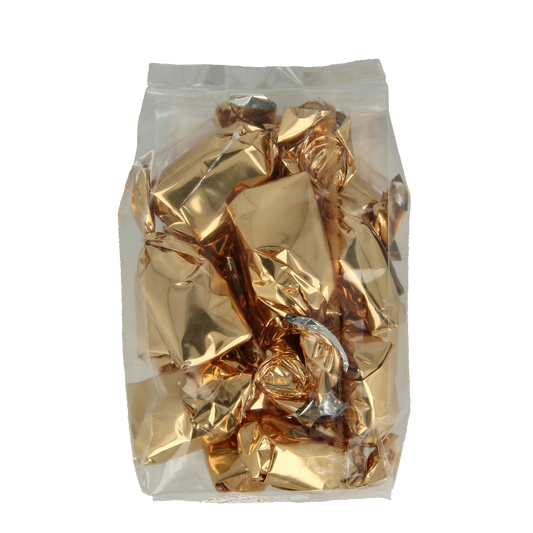 Michel Merlet Honing Bonbons with Royal Jelly in a clear jar, showcasing golden honey candies with a shiny, smooth surface.