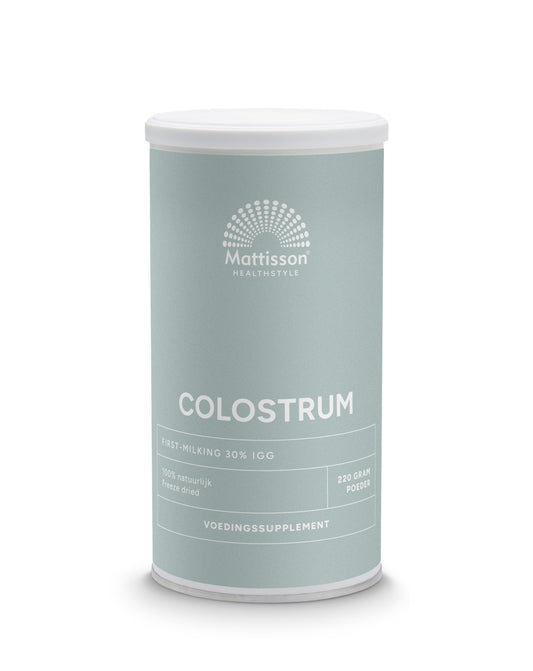 Mattisson Colostrum powder in a 220g container, showing the natural powder texture and packaging.
