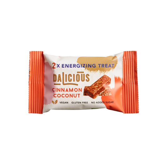 Dalicious Organic Cinnamon Coconut Snacks, 30g, showing coconut treats with cinnamon coating in a clear package.