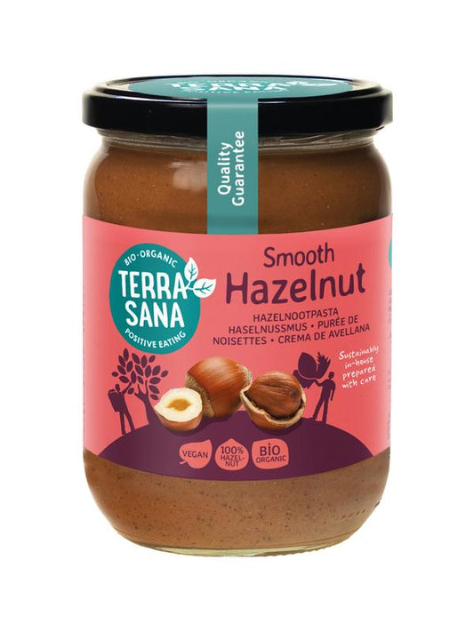 Organic TerraSana hazelnut spread jar with a label, 500g, showcasing the creamy hazelnut paste for bread or snacks.