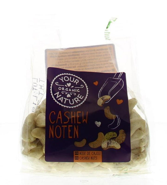 Raw organic cashew nuts from Your Organic Nature, displayed in a clear bowl, highlighting their creamy, natural texture.