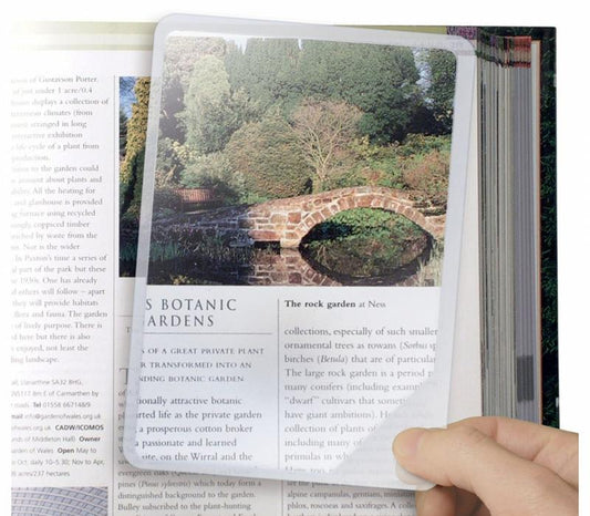 Able 2 flexible 1.00x magnifying glass for home and comfort, showing clear lens and ergonomic handle in use.