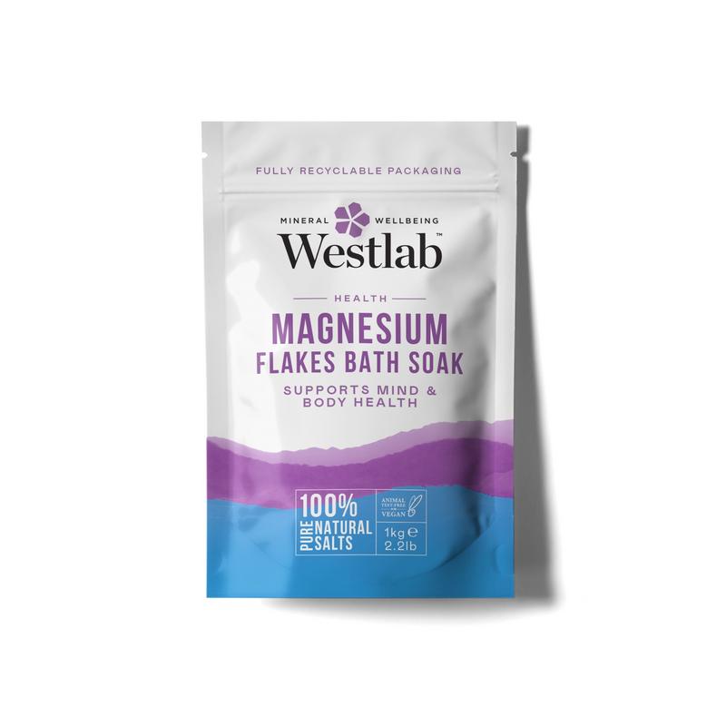 Westlab Magnesium flakes for bath and shower, 1 kilogram, showing textured white mineral flakes in a clear container.