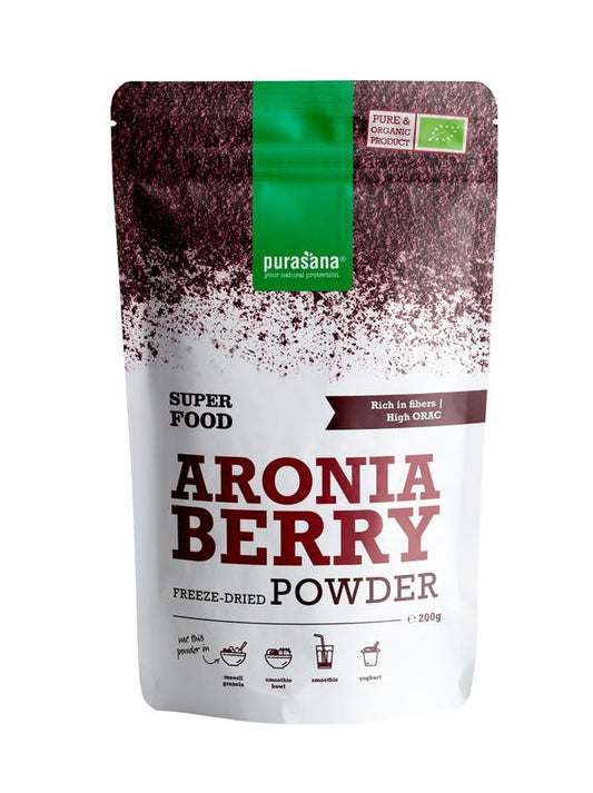 Purasana Aronia appelbespoeder vegan bio in 200g jar, shown with fresh aronia berries and apples on a wooden surface.