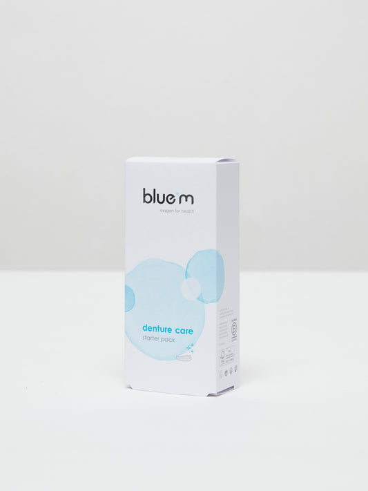 Bluem denture care pack with 24 pieces, showing cleaning tablets, brushes, and storage containers for prostheses.