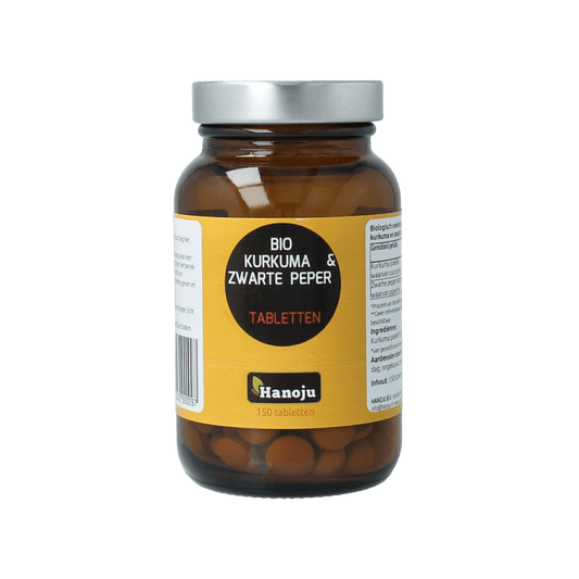 Hanoju Kurkumapoeder + piperine 500mg bio herbal tablets, natural turmeric and black pepper supplement in a bottle.