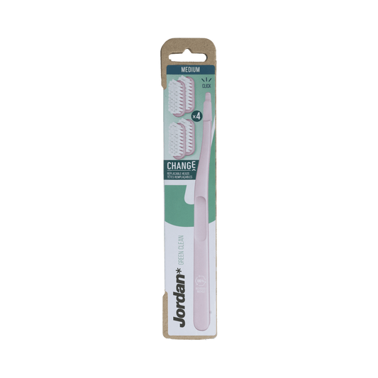 Set of four Jordan Green Clean Change Medium toothbrushes for effective oral hygiene, with green handles and soft bristles.