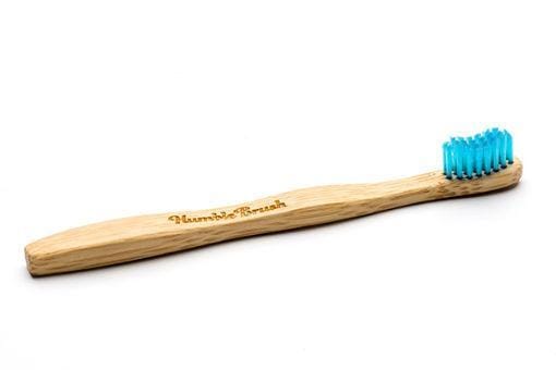 The Humble Co bamboo kids toothbrush in blue with soft bristles, designed for children, showing the eco-friendly bamboo handle.